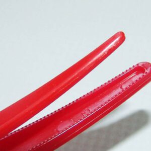Red Lucky Grip Clips holds hair