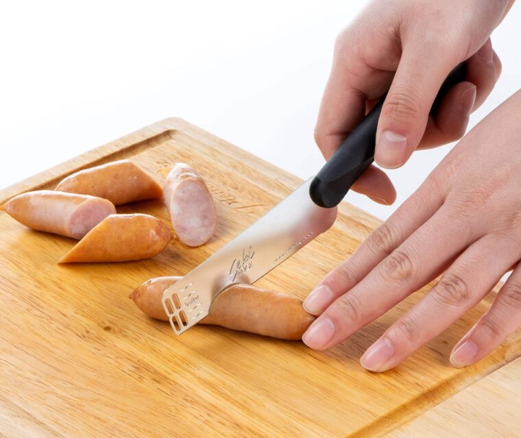 Seki Edge Butter Peeler and Knife SJ-K380 - cutting sausages